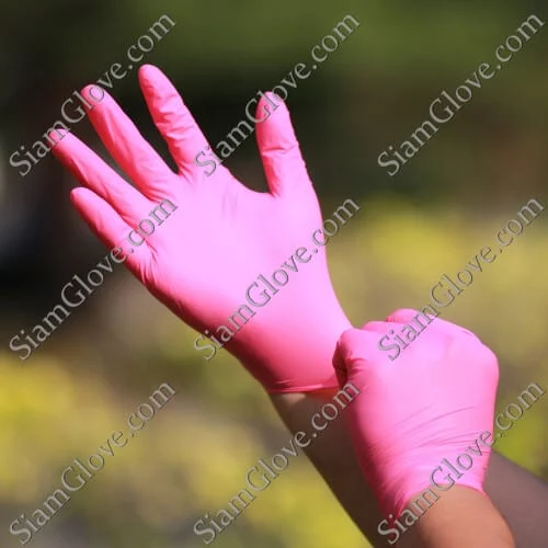 Pink disposable medical gloves, high-quality for healthcare and cleaning.